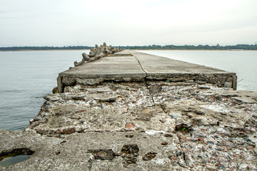 An old, pierced pier in the Baltic Sea
