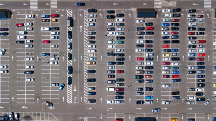 Aerial top view of parking lot with many cars from above, transportation and urban concept
