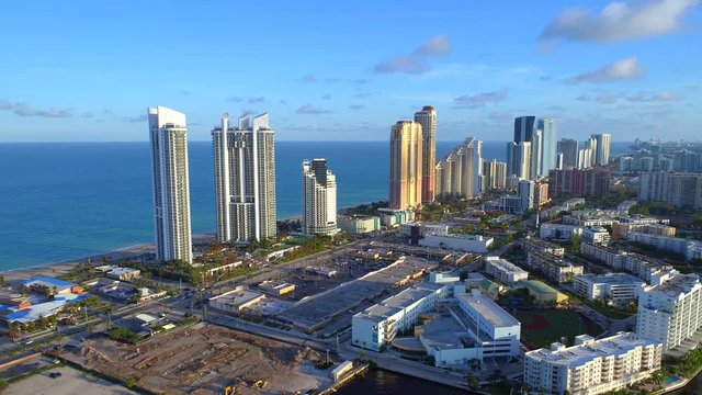 Aerial footage sunny Isles Beach condominiums and shopping centers