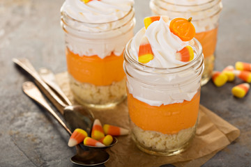 Halloween dessert in a jar layered candy corn parfait