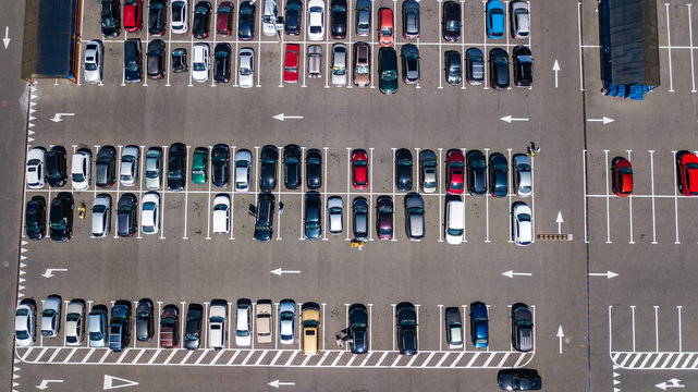 Aerial top view of parking lot with many cars from above, transportation and urban concept
