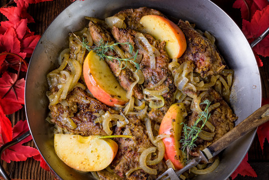 Fried liver with onion apple and herbs.