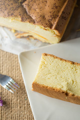 Hot tea cup and butter cake on Sack background