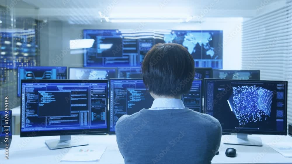 Poster In the System Control Monitoring Room Operator Works with Multiple Displays Showing Graphics, Logistics, Neural Networks. Data Center is Light and Full of Advanced Technologies.