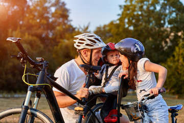 Happy family of three enjoying their time together in the park