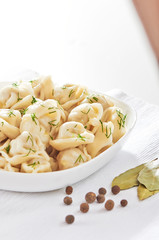 Russian cuisine hot meat dumplings served with herbs