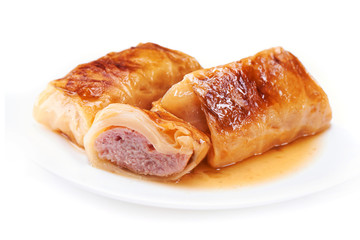 Stuffed cabbage rolls with pork meat isolated on white plate isolated on white background