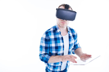 Confident smart man using a tablet