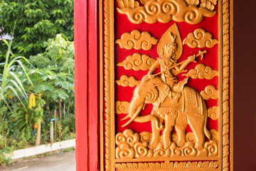 Buddhist carvings on the windows of the church in Rongngae temple at Nan Province, Thailand.