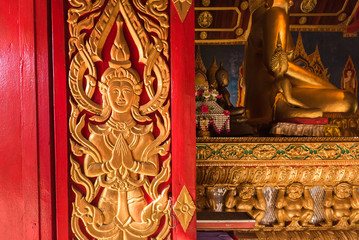 Buddhist carvings on the windows of the church in Rongngae temple at Nan Province, Thailand.