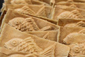 Taiyaki, One of the popular street food in Japan  fish-shaped cake fill with sweet red bean paste. Japanese Street food.