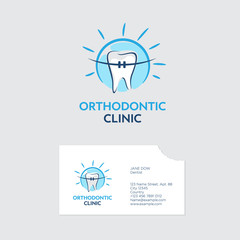 Orthodontist clinic logo. A tooth with braces in blue shine. Business card with a bite of even teeth.