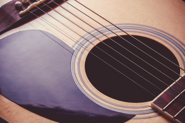 Naklejka premium Close Up shot photo of Classic acoustic guitar with filter effect retro vintage style