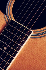 Obraz premium Close Up shot photo of Classic acoustic guitar with filter effect retro vintage style