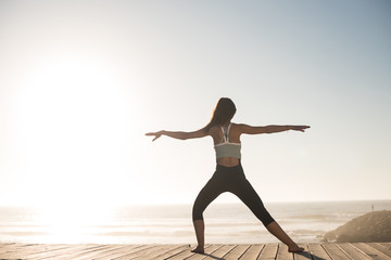 Women doing pilates on the beach