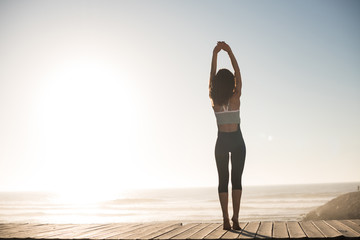 Women doing pilates on the beach