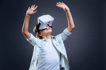 Happy delighted girl looking up