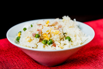 Homemade Chinese fried rice with vegetables and fried eggs