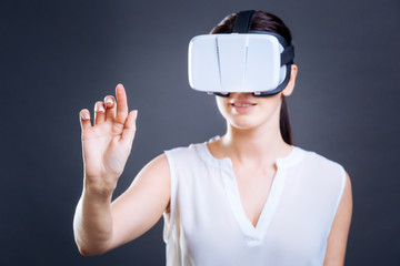 Attractive young businesswoman testing 3d technology