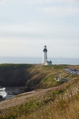 Fototapeta na wymiar Lighthouse by the Sea 
