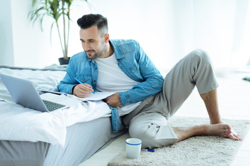 Young entrepreneur working on project at home