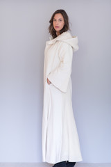 woman in a white coat with hood isolated on white background