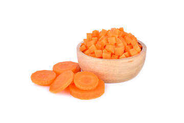 fresh portion cut carrot cube in wooden bowl on white background