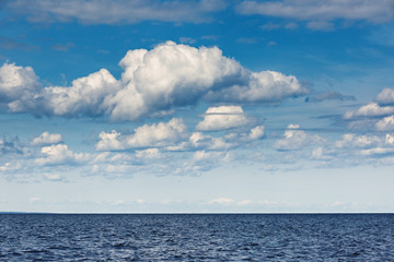 Naklejka na ściany i meble Sky with clouds over the sea