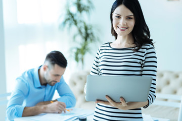 Young business lady smiling into camera
