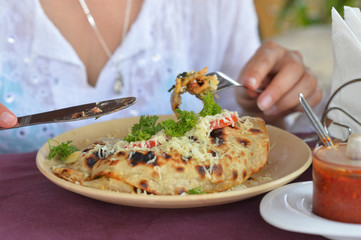 Woman eating at cafe