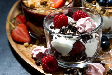 various desserts with berries and cream, closeup