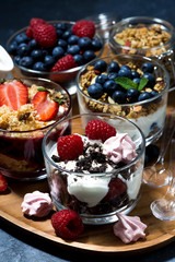 various desserts with berries and cream, vertical