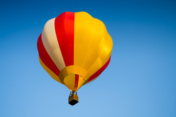 Colorful of Hot air balloon with fire and blue sky background