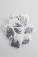 Pile of tea bags on a white table