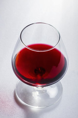 Glass of wine on white