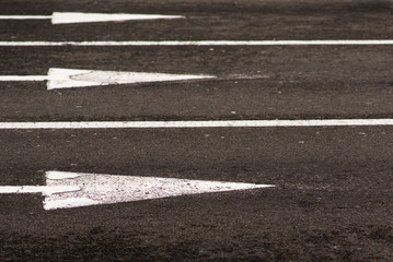 Central city avenue empty from cars. Arrows on asphalt