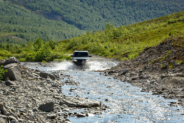 Off-road car driving  mountain river