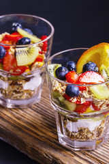 Homemade granola dessert on a wooden board, close up