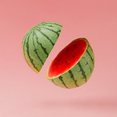 Watermelon sliced on pastel pink background. Minimal fruit concept.