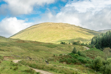Fototapeta na wymiar Scenic Landscape View of Mountain, Forest in Scottish Highland.