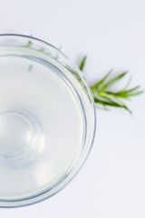 Refreshing alcoholic drink with lemon and rosemary, view from top