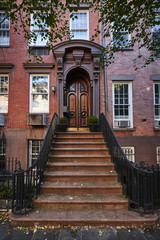 an ornate door on a brownstone building