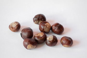 Fototapeta premium Fresh chestnuts on white background