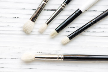 Assorted make up brushes, top view.