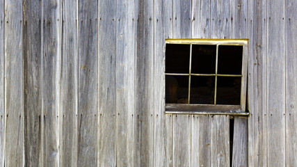 Obraz na płótnie Canvas Rustic barn wall with window background