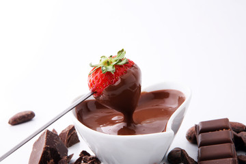 Fondue with Melting chocolate or melted chocolate and strawberry.