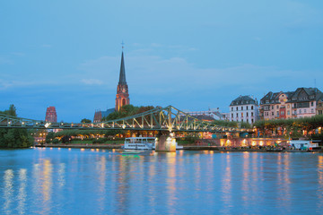 Fototapeta premium River, bridge, church and city. Frankfurt am Main, Germany