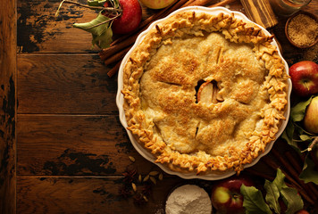 Apple pie decorated with fall leaves - obrazy, fototapety, plakaty