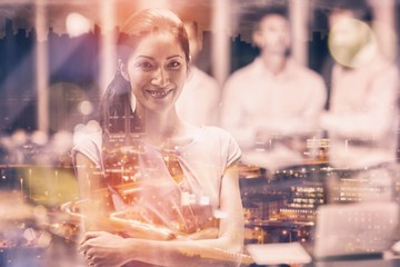 Composite image of high angle view of illuminated cityscape