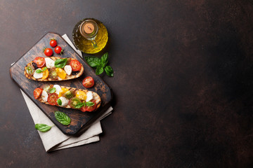 Bruschetta with tomatoes, mozzarella and basil